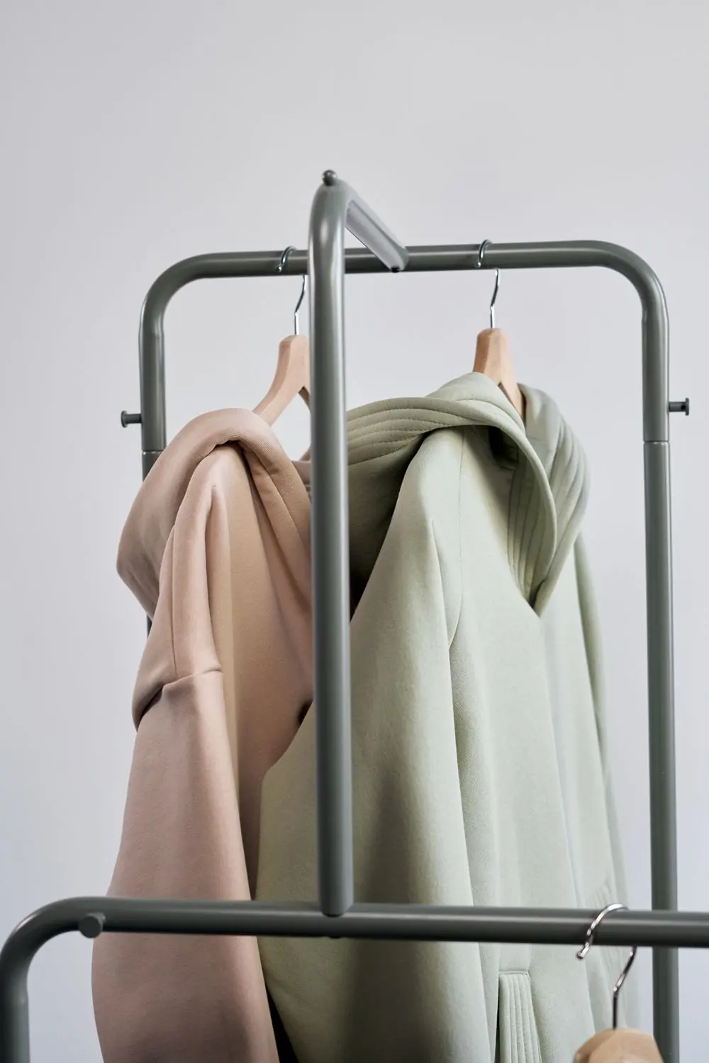 Reference photo 3: pastel hoodies on hangers — hoodies & sweatshirts we manufacture and export in bulk