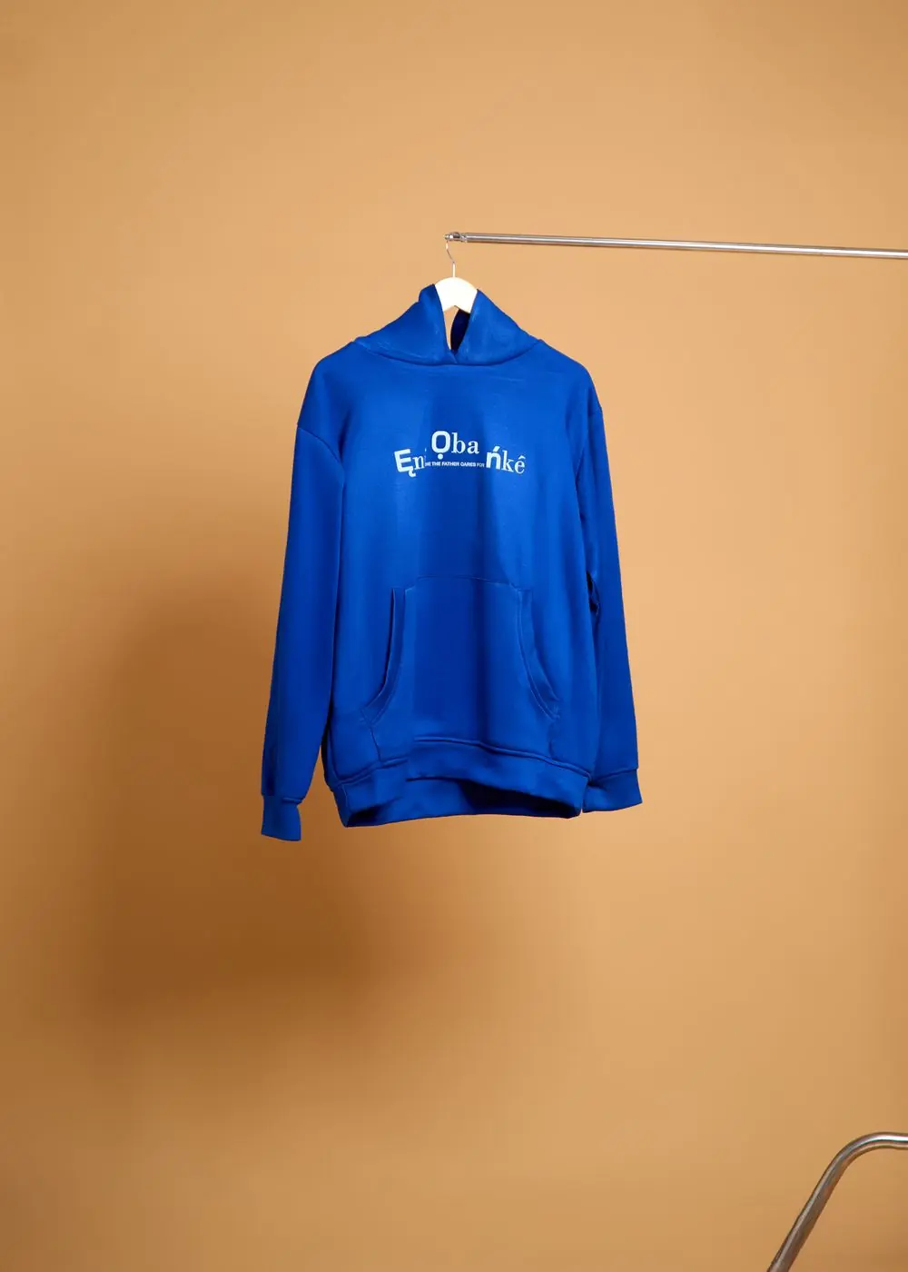 Reference photo 4: blue hoodie on a hanger — hoodies & sweatshirts we manufacture and export in bulk