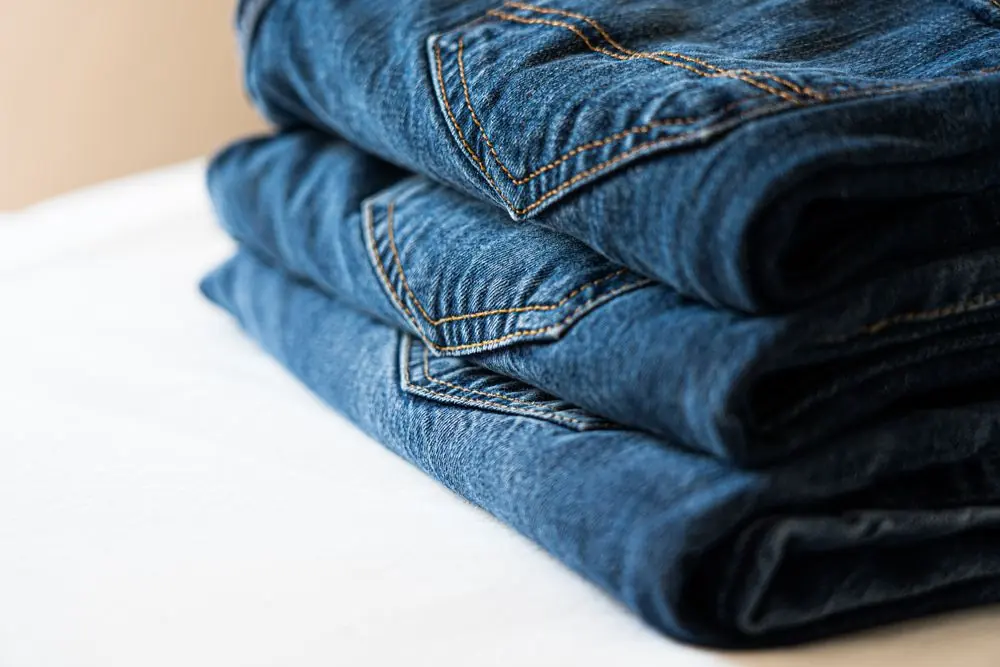 Reference photo 2: folded blue jeans showing pocket stitching — jeans we manufacture and export in bulk to South Africa