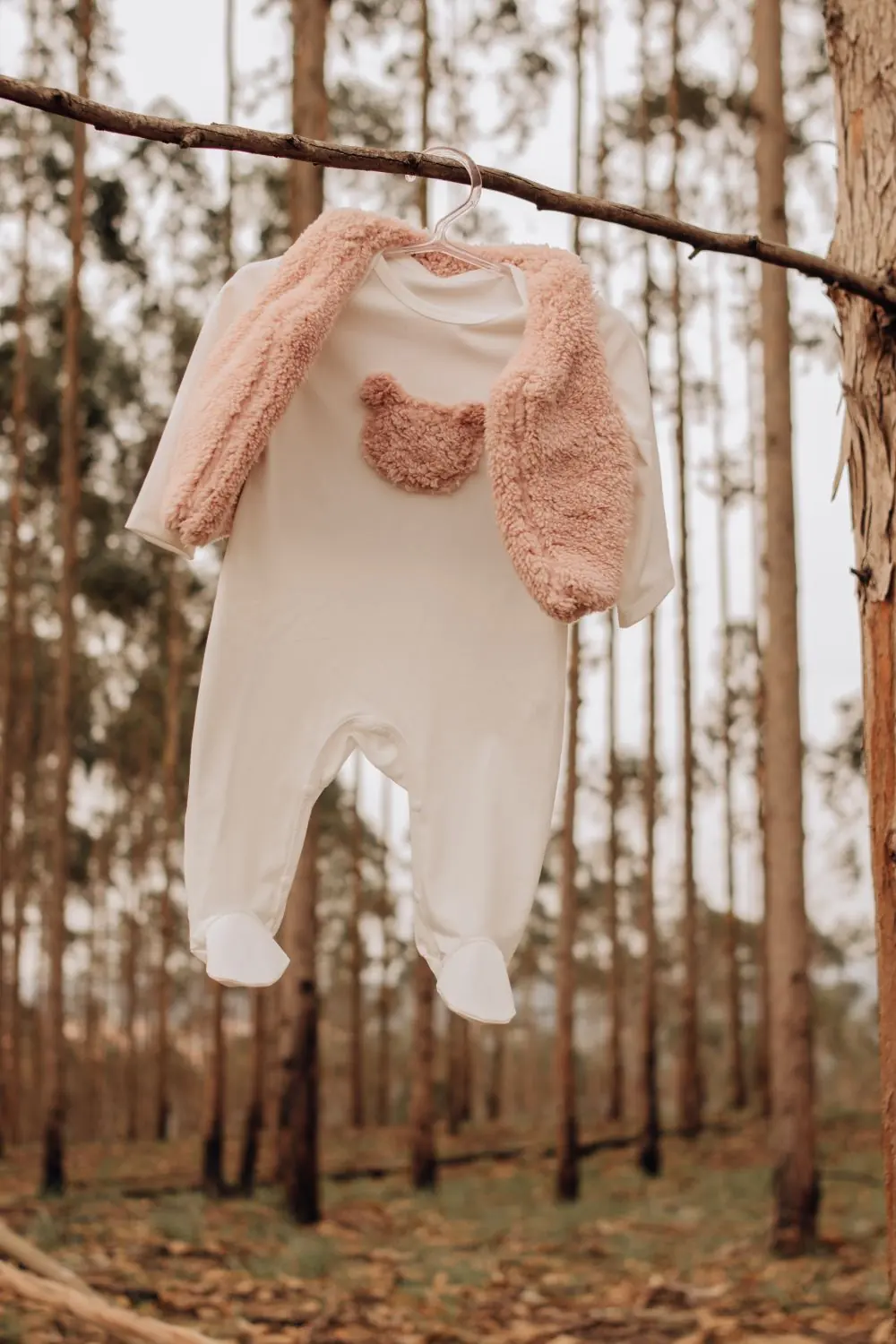 Reference photo 2: baby outfit hanging on a branch — kidswear we manufacture and export in bulk to Kenya