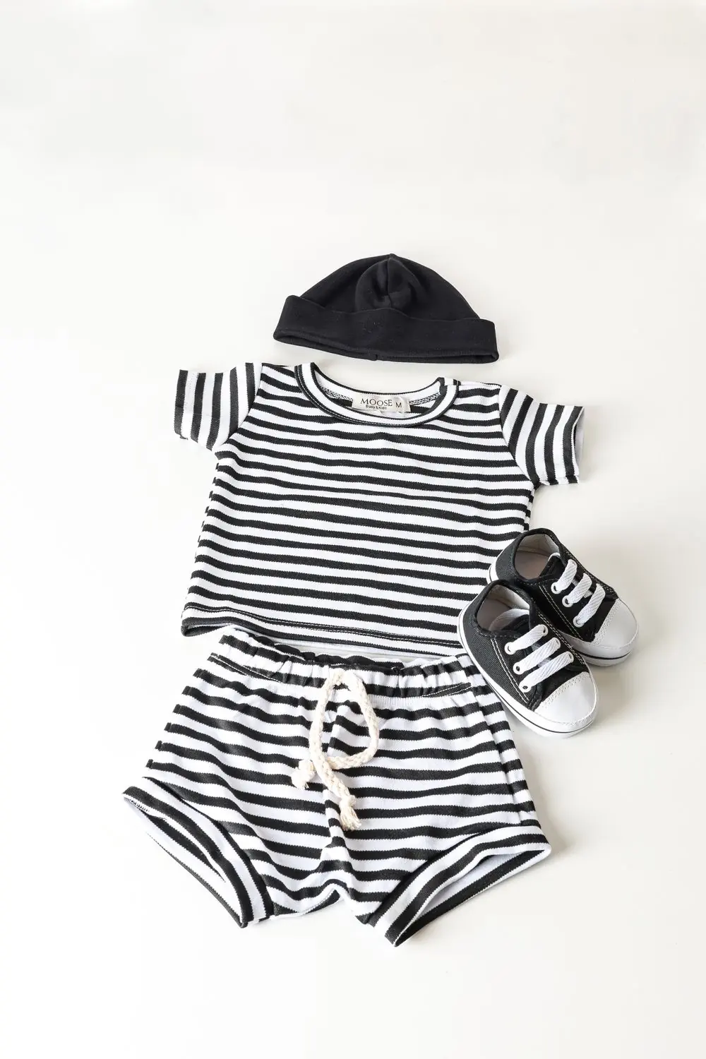 Reference photo 3: striped children's outfit laid flat — kidswear we manufacture and export in bulk to Kenya