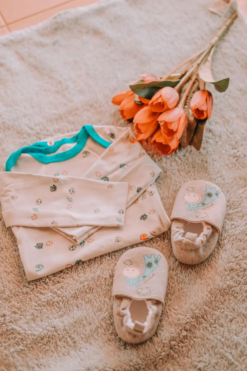 Reference photo 4: baby clothes laid flat — kidswear we manufacture and export in bulk to Kenya