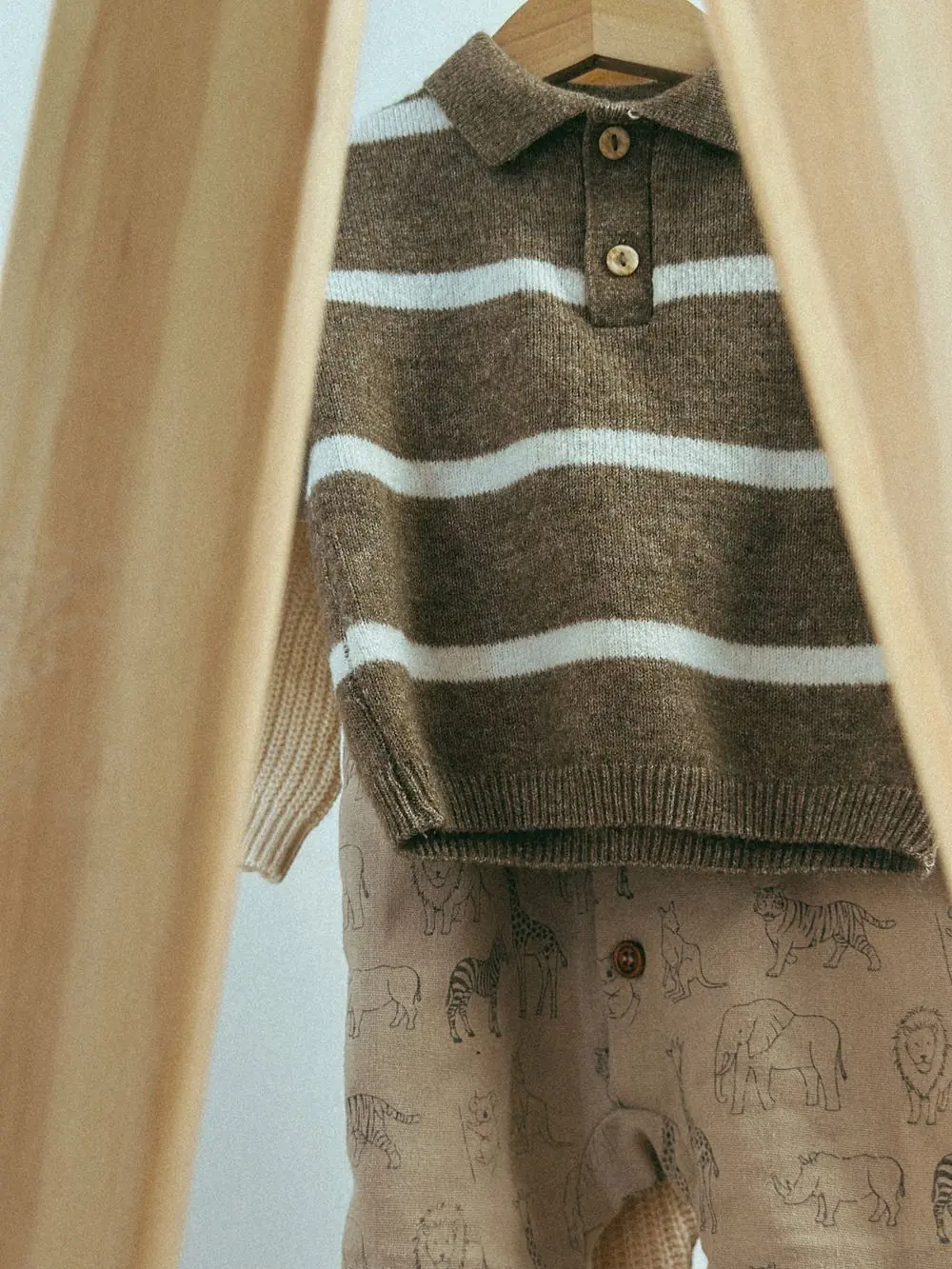 Reference photo 5: knitted children's top on a hanger — kidswear we manufacture and export in bulk to Kenya