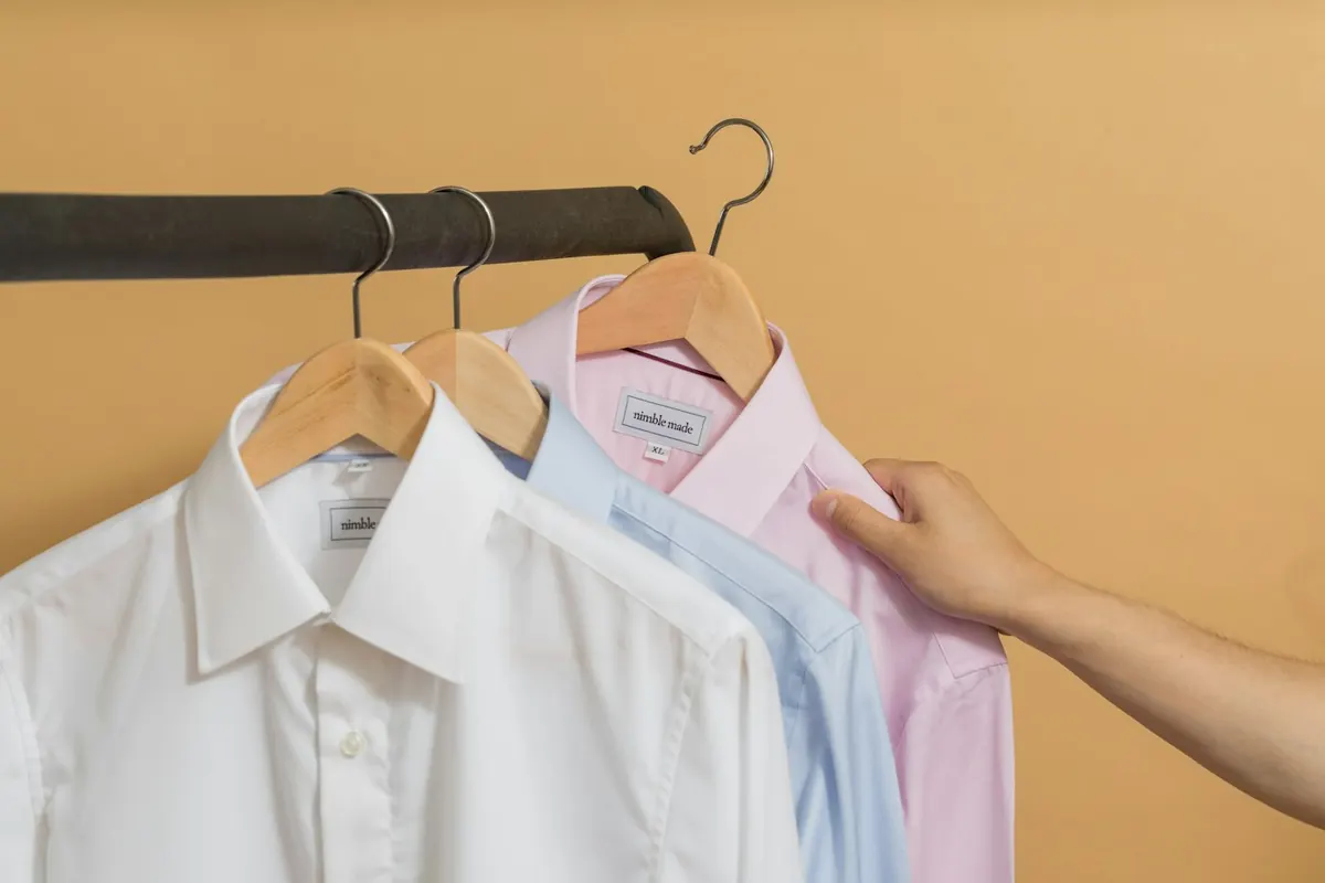 School Uniforms: white school-uniform style shirt on a hanger — reference photo from our export range