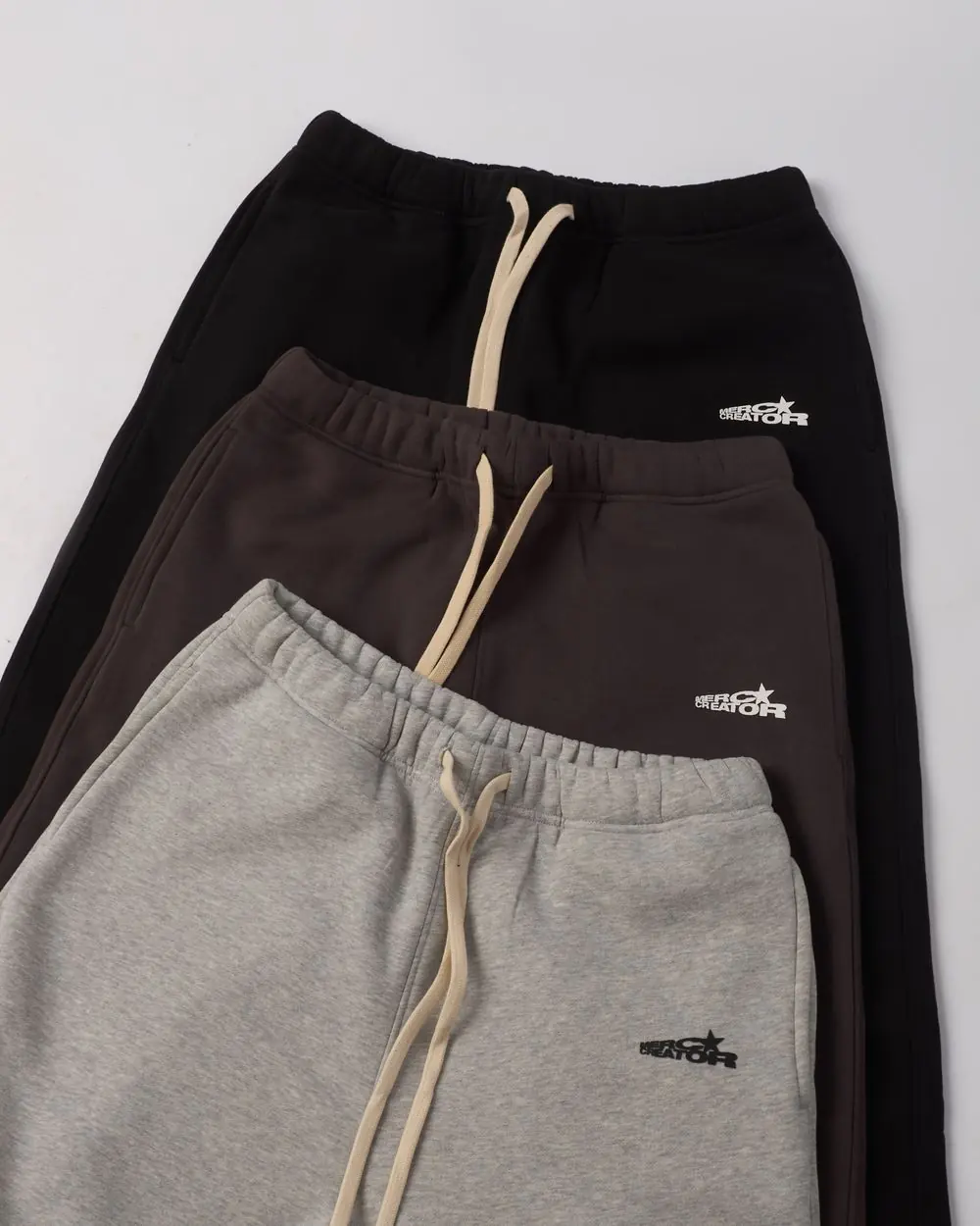 Reference photo 2: stacked drawstring sweatpants — track pants & shorts we manufacture and export in bulk to Kenya