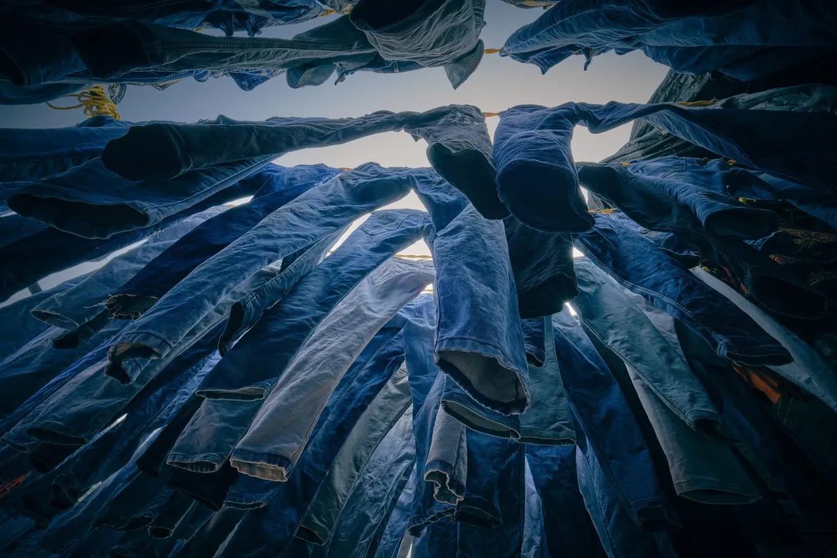 Trousers & Cargo Pants: rows of trousers hung out to dry — reference photo from our export range